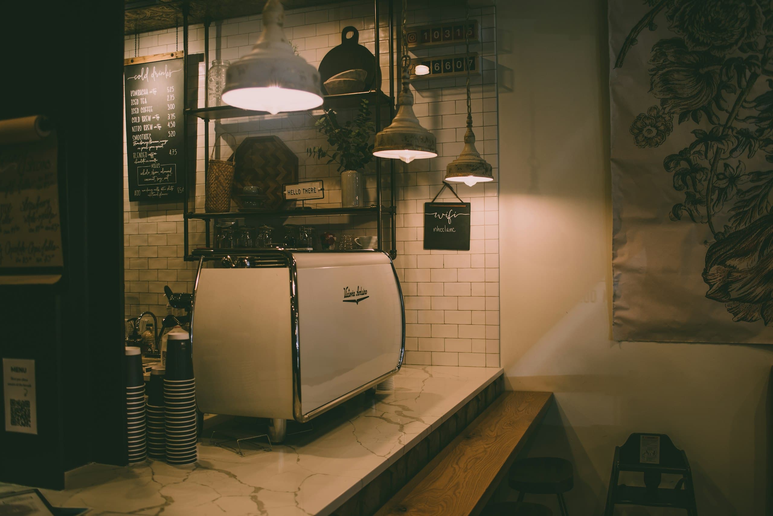 Coffee bar with an espresso machine under pendant lights