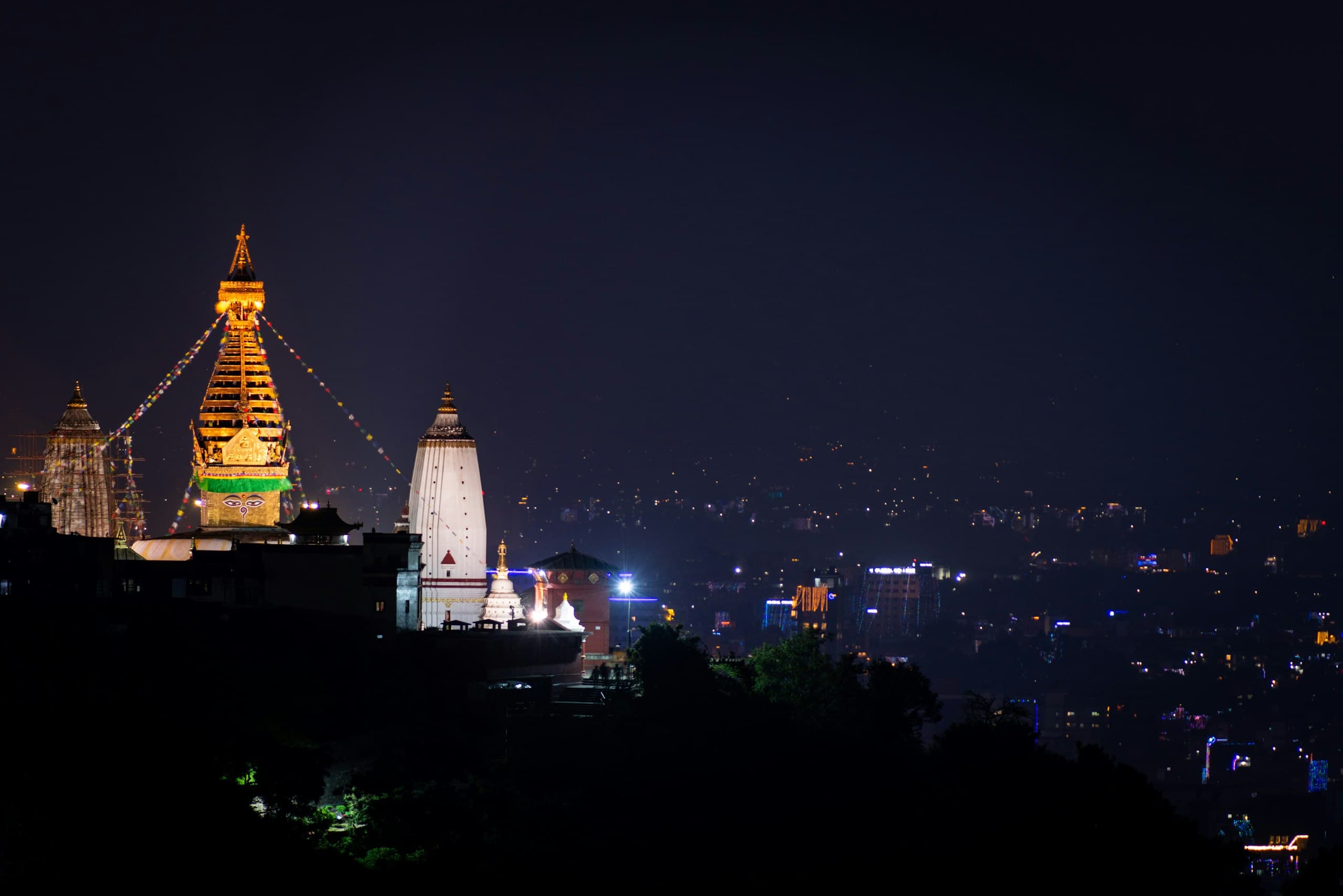 Swayambhunath stupa above the lights of Kathmandu at night