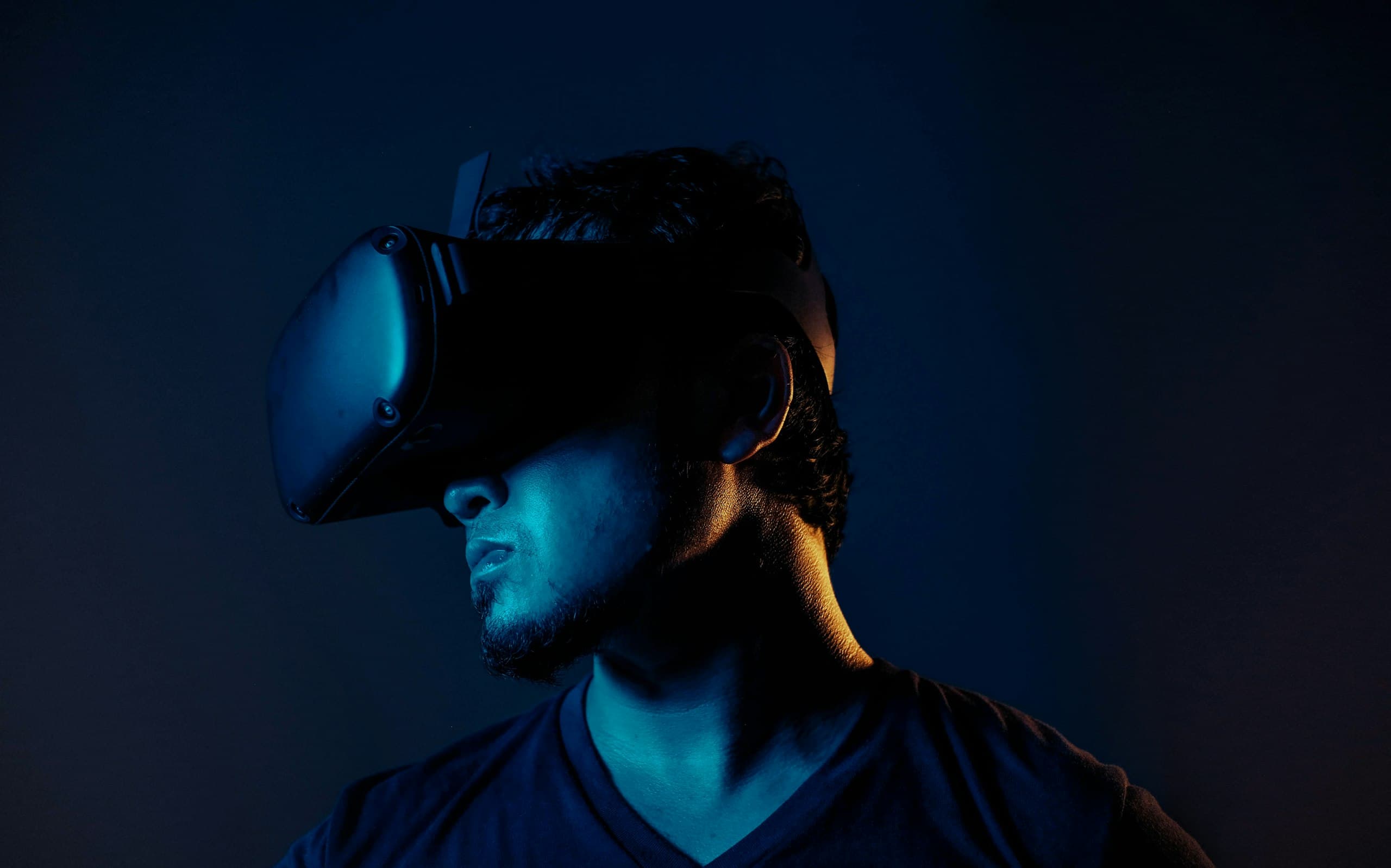 Person wearing a VR headset in blue light