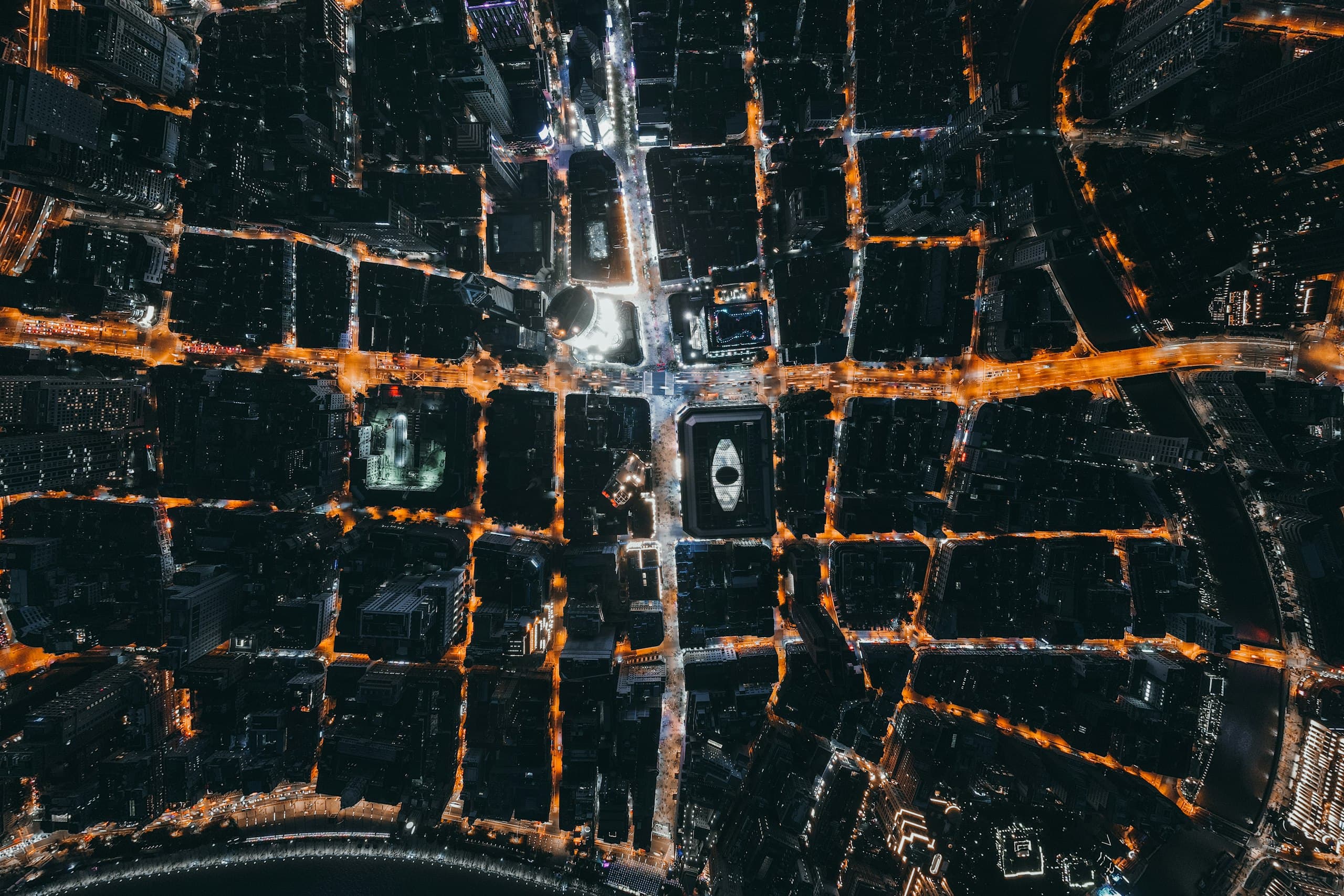 Aerial view of a city grid lit at night